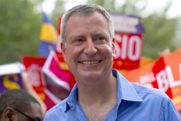 New York mayoral candidate Blasio participates in a march during the West Indian Day Parade in the Brooklyn borough of New York
